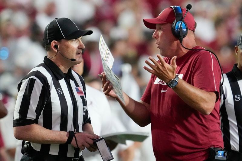 Alabama head coach Kalen DeBoer, right, argues with an official during the second half of an NCAA college football game against Vanderbilt, Saturday, Oct. 5, 2024, in Nashville, Tenn. (AP Photo/George Walker IV)