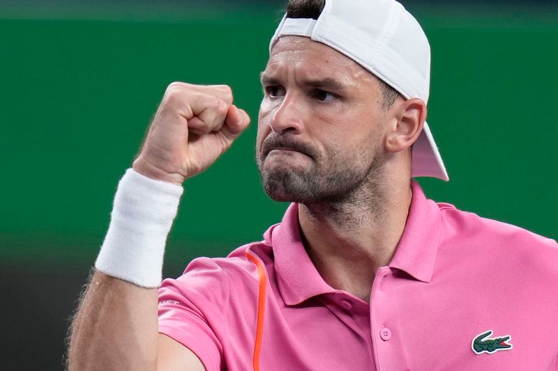 Grigor Dimitrov of Bulgaria reacts during the men's singles second round match against Zizou Bergs of Belgium in the Shanghai Masters tennis tournament at Qizhong Forest Sports City Tennis Center in Shanghai, China, Monday, Oct. 7, 2024. (AP Photo/Andy Wong)