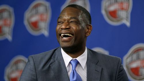 Former NBA basketball player Dikembe Mutombo laughs during a news conference announcing him as one of the 12 finalists of this year's hall of fame class during an event ahead of the NBA All Star basketball game, on Feb. 14, 2015, in New York. (AP Photo/Julio Cortez, File)