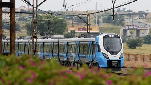 FILE - A newly launched Passenger Rail Agency of South Africa train traveling from Johannesburg to Naledi in Soweto, South Africa, Feb. 8, 2023. (AP Photo/Themba Hadebe, File)