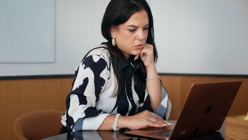 Entrepreneur Becky Litvintchouk works on her computer at a co-working space on Monday, Aug. 12, 2024, in New York. (AP Photo/Andres Kudacki)