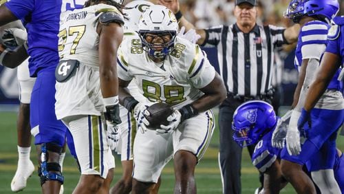 Georgia Tech Yellow Jackets defensive lineman Zeek Biggers (88) celebrates after recovering  a first half fumble that led to a tech score during  a NCAA football game between the  Georgia State Panthers and the Georgia Tech Yellow Jackets at Bobby Dodd Stadium in Atlanta on Saturday, Aug. 31, 2024.   (Bob Andres for the Atlanta Journal Constitution)