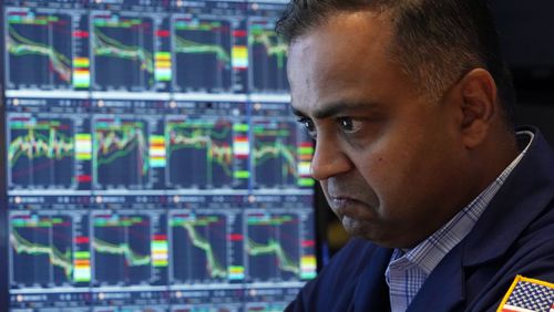 Specialist Dilip Patel works at his post on the floor of the New York Stock Exchange, Monday, Aug. 5, 2024. Nearly everything on Wall Street is tumbling as fear about a slowing U.S. economy worsens and sets off another sell-off for financial markets around the world.(AP Photo/Richard Drew)