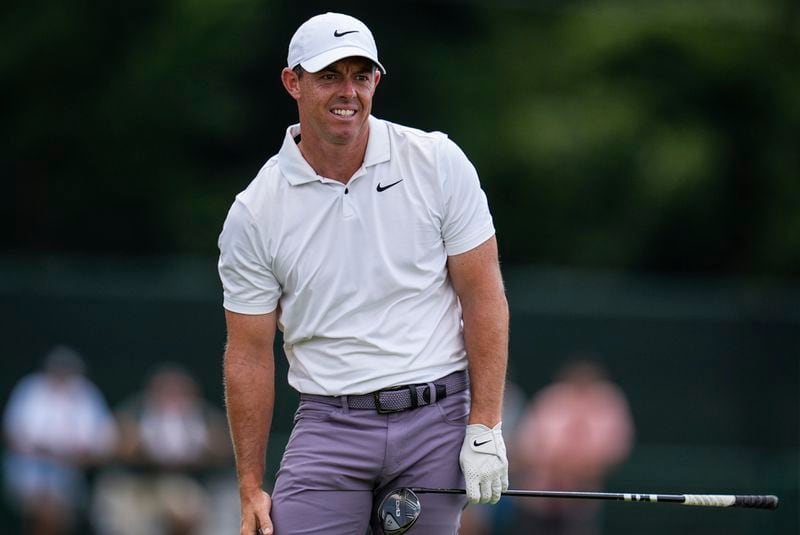 Rory McIlroy, of Northern Ireland, watches his ball on the eighth hole during the second round of the Tour Championship golf tournament, Friday, Aug. 30, 2024, in Atlanta. (AP Photo/Mike Stewart)