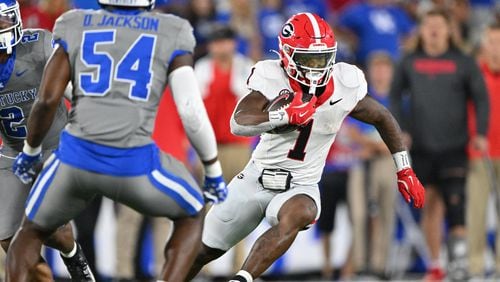 Georgia running back Trevor Etienne (1) runs with the ball during the second half in an NCAA football game at Kroger Field, Saturday, September 14, 2024,  in Lexington, Kentucky. Georgia won 13-12 over Kentucky. (Hyosub Shin / AJC)