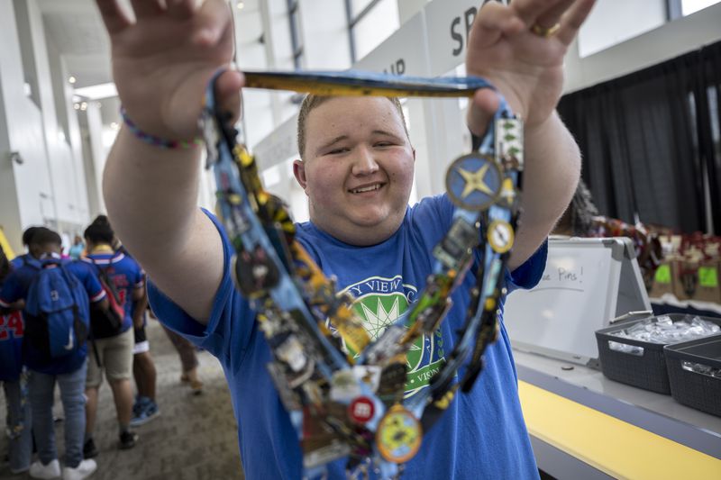 SAVANNAH, GA - JUNE 18, 2024: National Beta Club senior Bull Higginbotham from University View Academy shows off his convention lanyards with dozens of pins he has collected, Tuesday, June 18, 2024, in Savannah, Ga. (AJC Photo/Stephen B. Morton)