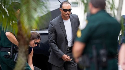 Tiger Woods arrives at the North County Courthouse in Palm Beach Gardens, Florida on October 27, 2017. Tiger Woods is expected to plead guilty "in abstentia" to a charge of reckless driving in connection with his May arrest for DUI. A long-awaited plea deal, that would allow Woods to enter a DUI diversion program, is expected to be approved by Palm Beach County Judge Sandra Bosso-Pardo at a hearing at the North County Courthouse in Palm Beach Gardens.
