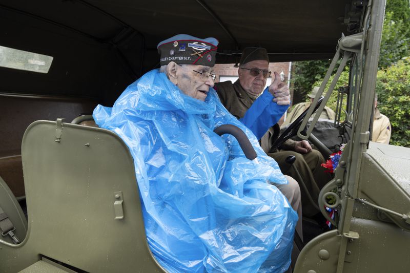 World War II veteran Kenneth Thayer flashes a thumbs up from a jeep during a ceremony marking the 80th anniversary of the liberation of the south of the Netherlands in Mesch, Thursday, Sept. 12, 2024. (AP Photo/Peter Dejong, Pool)