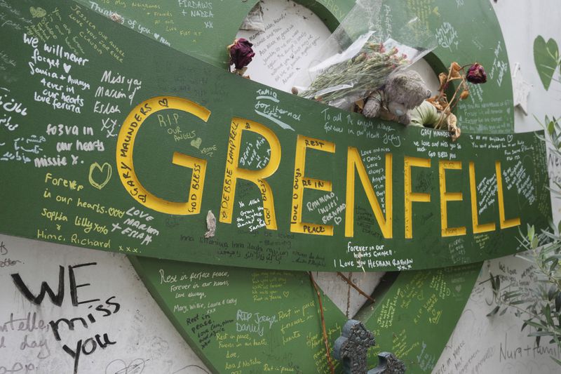 A view of the memorial wall by the remains of the Grenfell Tower after a fire in June, 2017, in London, Monday, Sept. 2, 2024, in which 72 people were killed. ((AP Photo/Kin Cheung)