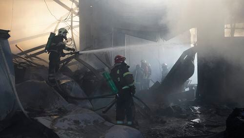 Firefighters put out a fire after Russian attack in Kharkiv, Ukraine, Saturday, May, 25, 2024. (AP Photo/Andrii Marienko)