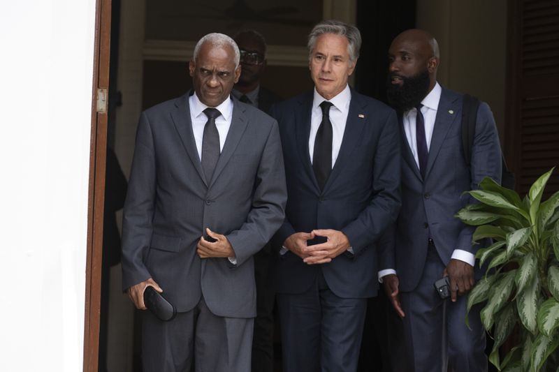 U.S. Secretary of State Antony Blinken, center, and Haitian Transitional Presidential Council Coordinator Edgard Leblanc Fils, left, arrive to speak to the press at the U.S. Chief of Mission Residence in Port-au-Prince, Haiti, Thursday, Sept. 5, 2024. (Roberto Schmidt/Pool photo via AP)