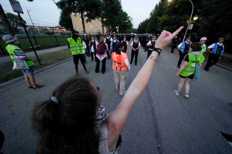 Protesters march during a demonstration outside the Democratic National Convention Thursday, Aug. 22, 2024, in Chicago. (AP Photo/Julio Cortez)