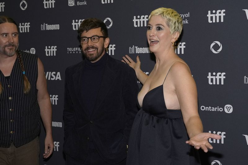 Nate Heller, from left, Jorma Taccone, and director Marielle Heller attend the premiere of "Nightbitch" at Princess of Wales Theatre during the Toronto International Film Festival on Saturday, Sept. 7, 2024, in Toronto. (AP Photo/Chris Pizzello)