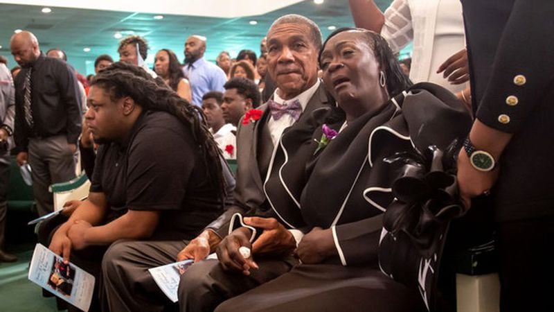 <p>Johnny and Kathie White listen during the funeral service for their daughter Sandra White and her son Arkeyvion White at the Mount Carmel Baptist Church. (Photo: STEVE SCHAEFER / SPECIAL TO THE AJC)</p>