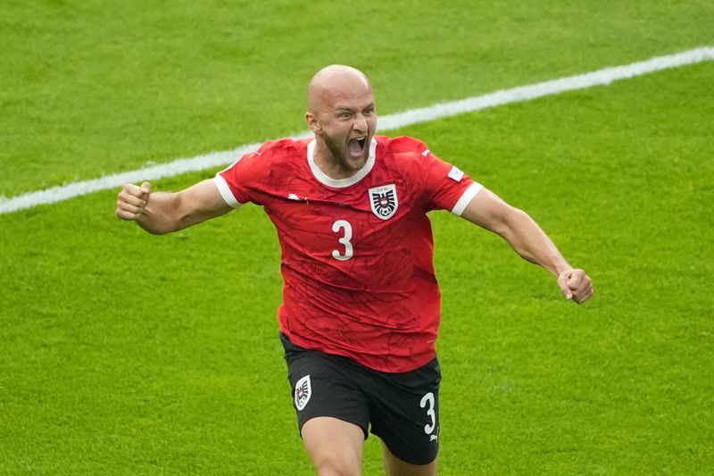 Austria's Gernot Trauner celebrates after scoring the opening goal during a Group D match between Poland and Austria at the Euro 2024 soccer tournament in Berlin, Germany, Friday, June 21, 2024. (AP Photo/Petr Josek)