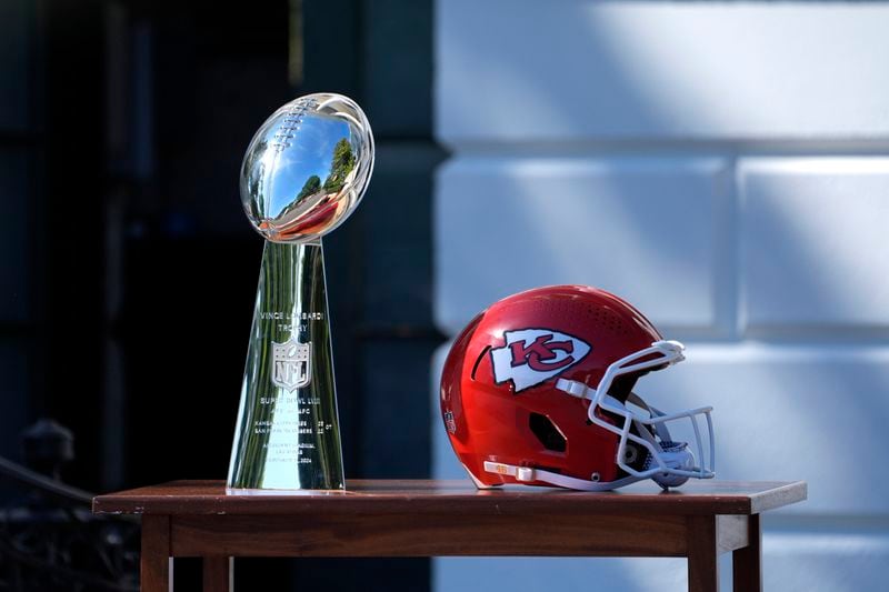 The Lombardi Trophy and a Kansas City Chiefs football helmet are displayed on a table before an event with President Joe Biden and the Super Bowl-champion Kansas City Chiefs on the South Lawn of the White House, Friday, May 31, 2024, to celebrate their championship season and victory in Super Bowl LVIII. (AP Photo/Evan Vucci)
