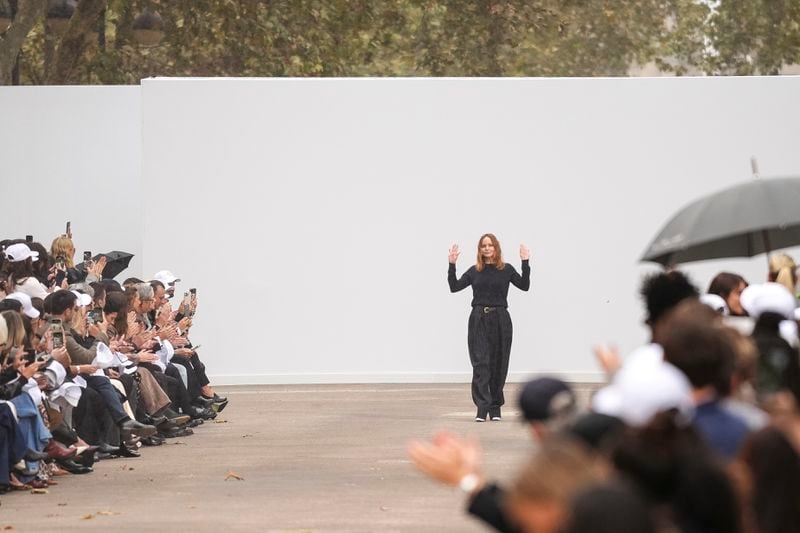 Designer Stella McCartney accepts applause after her Spring/Summer 2025 collection presented Monday, Sept. 30, 2024 in Paris. (Photo by Scott A Garfitt/Invision/AP)