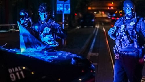 Atlanta police investigate a deadly shooting near the intersection of Edgewood Avenue and Hilliard Street early Wednesday morning. John Spink / John.Spink@ajc.com