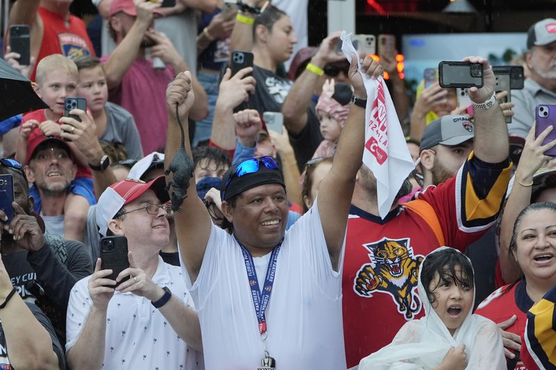 Fans cheer the Florida Panthers hockey team during an NHL hockey parade and rally, Sunday, June 30, 2024, in Fort Lauderdale, Fla. The Panthers defeated the Edmonton Oilers to win the Stanley Cup. (AP Photo/Marta Lavandier)