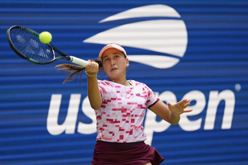 Kamilla Rakhimova, returns a shot to Iga Swiatek, of Poland, during the first round of the U.S. Open tennis championships, Tuesday, Aug. 27, 2024, in New York. (AP Photo/Kirsty Wigglesworth)