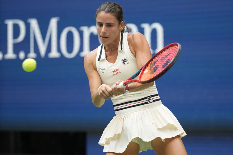 Emma Navarro, of the United States, returns a shot to Coco Gauff, of the United States, during the fourth round of the U.S. Open tennis championships, Sunday, Sept. 1, in New York. 2024. (AP Photo/Pamela Smith)