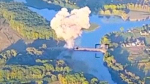 In this footage released by the Ukrainian armed forces on Sunday, Aug. 18, 2024, smoke billows in . what is said to show the destruction of a key bridge in Russia's Kursk region. Ukraine has destroyed a key bridge in Russia's Kursk region and struck a second one nearby, less than two weeks into its stunning cross-border incursion, disrupting Russian supply routes and possibly signaling that its troops are planning to dig in. (Ukrainian Armed Force via AP)