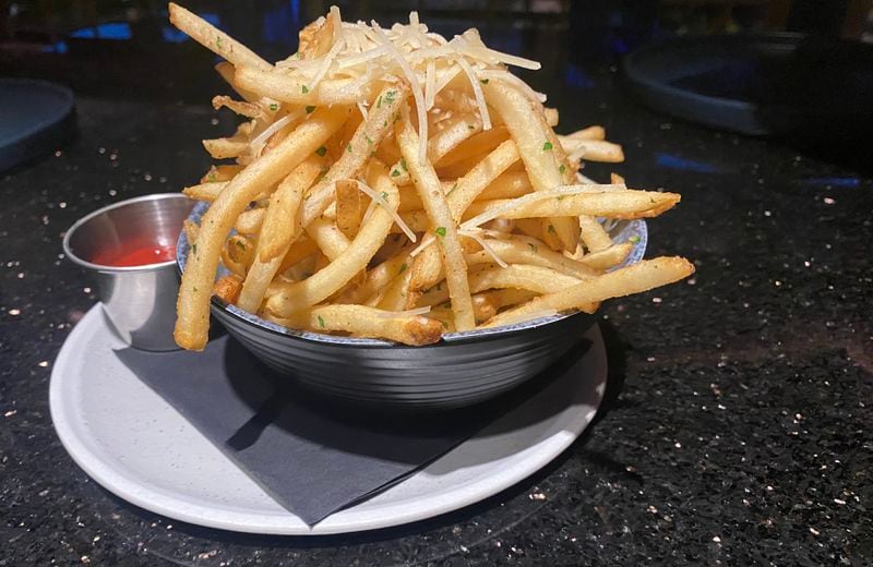 Humble Pie's Not So Humble shoestring fries are, in fact, rather decadent — showered with truffle and Parmesan. Ligaya Figueras/ligaya.figueras@ajc.com  