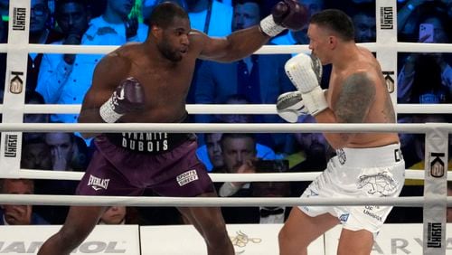 FILE - Britain's Daniel Dubois, left, and Ukraine's Oleksandr Usyk during their world heavyweight title fight at Tarczynski Arena in Wroclaw, Poland, Saturday, Aug. 26, 2023. (AP Photo/Czarek Sokolowski, file)