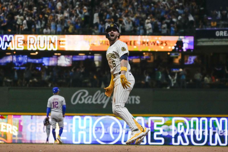 Milwaukee Brewers' Garrett Mitchell celebrates afrer hitting a two-run home run during the eighth inning of Game 2 of a National League wild card baseball game against the New York Mets Wednesday, Oct. 2, 2024, in Milwaukee. (AP Photo/Morry Gash)