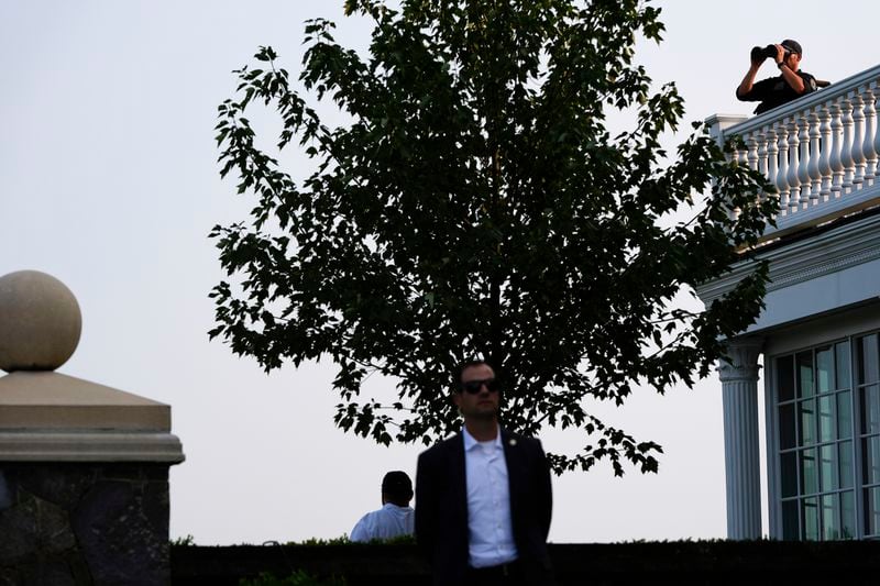 FILE - U.S. Secret Service agents stand watch as Republican presidential nominee former President Donald Trump speaks at a news conference at Trump National Golf Club, Aug. 15, 2024, in Bedminster, N.J. (AP Photo/Julia Nikhinson, File)