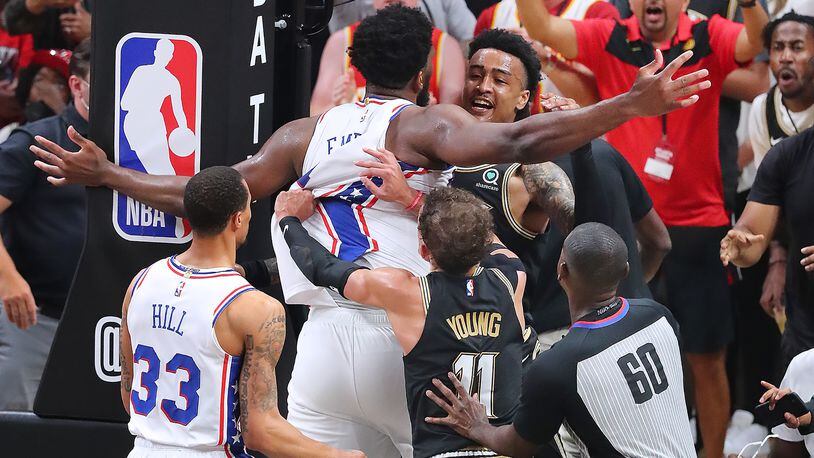 John Collins put Joel Embiid in a choke hold and dunked on him!”: NBA fans  react to the Hawks big man's emphatic lob dunk from Trae Young over the  Sixers MVP in