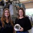 Cindy Taff, right, and Brianna Byrd, left, with Sage Geosystems, a startup that aims to make clean electricity, pose while visiting Southwest Research Institute where testing and research is taking place in San Antonio, Monday, April 1, 2024. (AP Photo/Eric Gay)