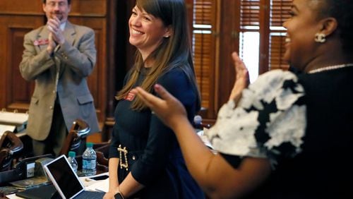 Rep. Teri Anulewicz (D-Smyrna) is congratulated after her first bill passed the house, March 1, 2019. (Bob Andres/The Atlanta Journal-Constitution/TNS)