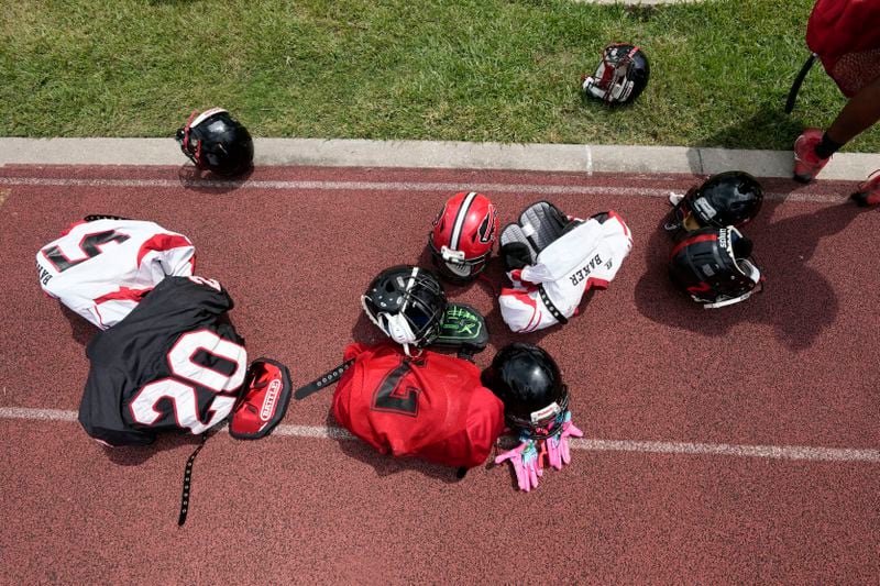 Equipment sits on the field as the Baker High football teams readies for practice in Baker, La., Wednesday, Aug. 28, 2024. (AP Photo/Gerald Herbert)