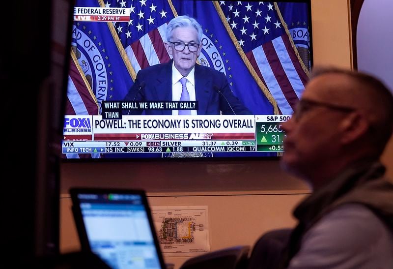 The news conference of Federal' Reserve Chair Jerome Powell appears on a screen as trader Neil Catania works on the floor of the New York Stock Exchange, Wednesday, Sept. 18, 2024. (AP Photo/Richard Drew)