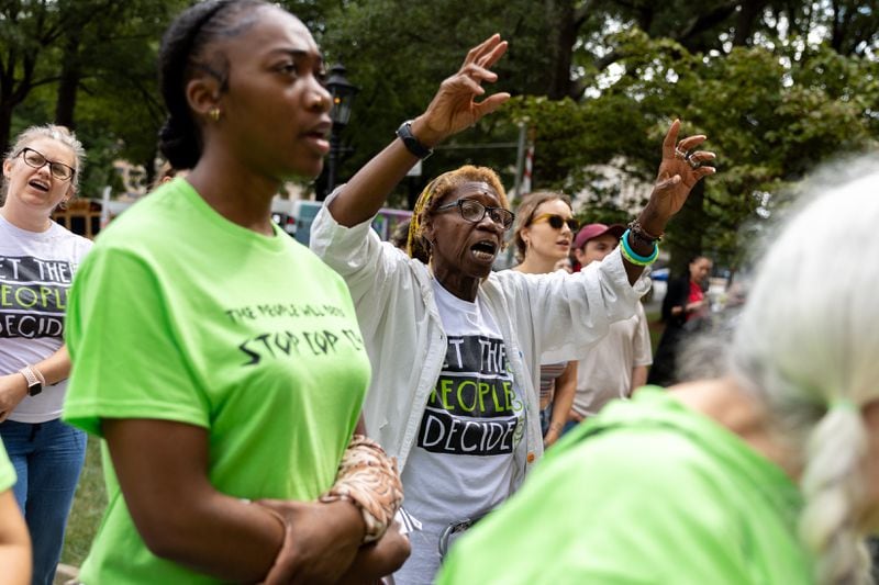 Opponents of an under-construction law enforcement training center, known to some as “Cop City,” protest at City Hall in Atlanta on Monday, September 16, 2024. It’s been one year since opponents submitted a petition to force a referendum to block the project. (Arvin Temkar / AJC)