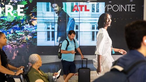 Travelers are seen in the domestic terminal of Hartsfield-Jackson airport in Atlanta on Friday, June 30, 2023. (Arvin Temkar / arvin.temkar@ajc.com)