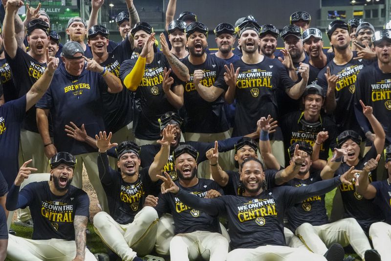 The Milwaukee Brewers celebrate after a baseball game against the Philadelphia Phillies Wednesday, Sept. 18, 2024, in Milwaukee. The Brewers won 2-1 and clinched the National League Central division. (AP Photo/Morry Gash)