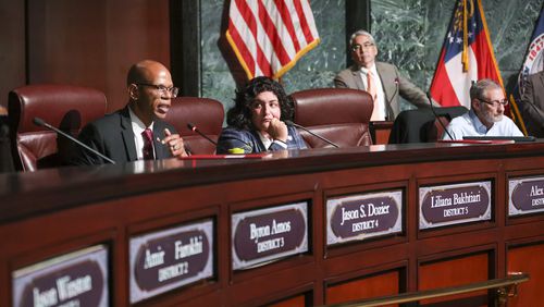 Council member Jason Dozier, left, speaks next to Liliana Bakhtiari before the council members voted 11 to 4 to approve legislation to fund the training center, on Tuesday, June 6, 2023, in Atlanta. Both Dozier and Bakhtiari voted against the funding. (Jason Getz / Jason.Getz@ajc.com)