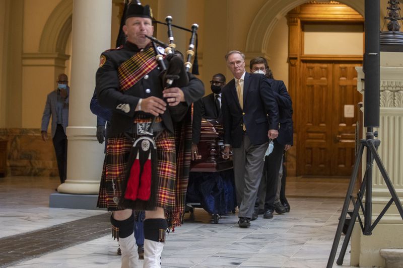 07/22/2020 - Atlanta, Georgia - A bagpiper leads the body of C.T. Vivian to the rotunda of the Georgia State Capitol building for a special service to honor his legacy, Wednesday, July 22, 2020. (ALYSSA POINTER / ALYSSA.POINTER@AJC.COM)