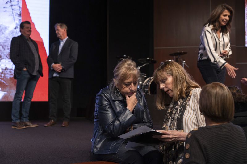 Karen England, center, speaks with attendees of a Comeback California Tour event at Revival Fellowship, Saturday, Sept. 21, 2024, in Menifee, Calif. (AP Photo/Zoë Meyers)