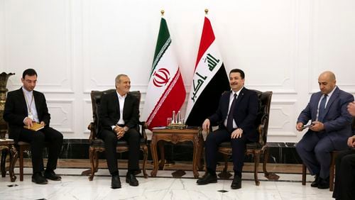 Iranian President Masoud Pezeshkian, center left, and Iraqi Prime Minister Mohammed Shia al-Sudani, center right, meet at the government palace in Baghdad, Iraq, Wednesday, Sept. 11, 2024. (Ahmed Jalil/Pool Photo via AP)