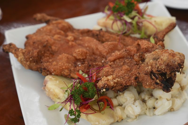 A guinea pig dish is ready to be served to a customer at a restaurant in Lima, Peru, Thursday, Oct. 3, 2024. Guinea pigs, locally known as 'cuy,' have been traditionally raised for meat consumption since pre-Inca times. (AP Photo/Guadalupe Pardo)