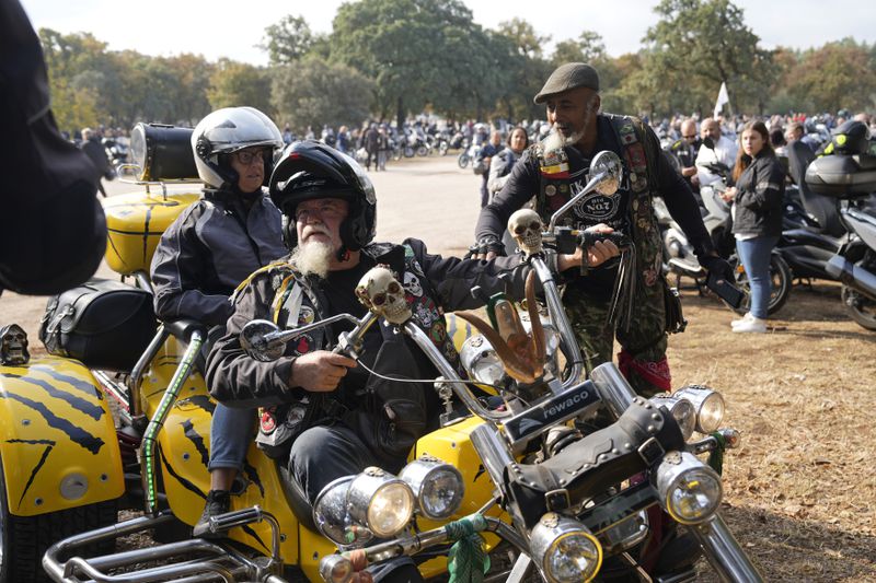 Motorcyclists arrive at the parking lots around the Roman Catholic holy shrine of Fatima to attend the IX Pilgrimage of the Blessing of Helmets that draws tens of thousands, in Fatima, Portugal, Sunday, Sept. 22, 2024. (AP Photo/Ana Brigida)