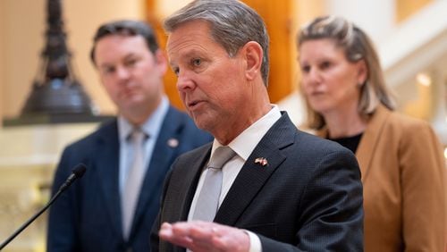 221208-Atlanta-Lt. Gov. elect Burt Jones (R-Jackson), left, and House Speaker Jan Jones (R-Milton) flank Gov. Brian Kemp as he announces some of his Legislative agenda during a press conference Thursday, Dec. 8, 2022 at the State Capitol. (Ben Gray for the Atlanta Journal-Constitution