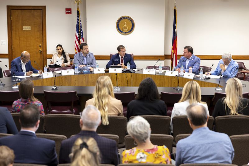 The state senate's Special Committee on Protecting Women's Sports meets to hear testimony from swimmers in opposition to transgender athletes in women's sports at the Capitol in Atlanta, Tuesday, Aug. 27, 2024. (Arvin Temkar/Atlanta Journal-Constitution via AP)