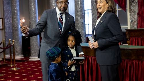 Senator Reverend Raphael Warnock (D-GA) arrives with his two children for his ceremonial swearing in with Vice President Kamala Harris at the Capitol in Washington, DC on January 3rd, 2022. (Nathan Posner for the Atlanta Journal-Constitution)