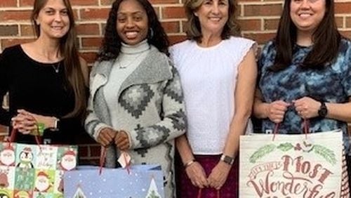 Adopt-A-Senior program is held each holiday season by the Cherokee County Senior Services. Donated gift bags are delivered to the CCSS clients. (Pictured: Leslie White, Jasmine McKinney, HDM Supervisor/Volunteer Coordinator Alice O Micham and Brittany Kiser.