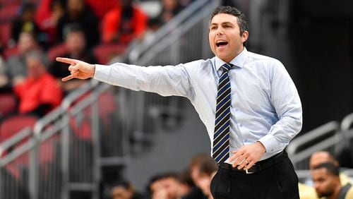 Georgia Tech head coach Josh Pastner signals to his team during the first half of an NCAA college basketball game against Louisville in Louisville, Ky., Wednesday, Feb. 1, 2023. (AP Photo/Timothy D. Easley)