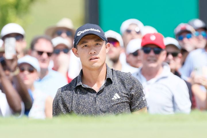 Collin Morikawa watches the ball out of the bunker on the seventh green during the final round of the Tour Championship at East Lake Golf Club, Sunday, Sept. 1, 2024, in Atlanta.
(Miguel Martinez / AJC)